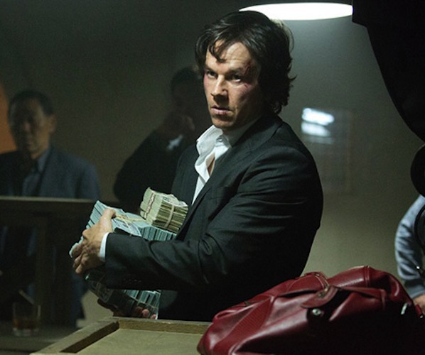Mark Warlberg carting off a load of cash in "The Gambler."