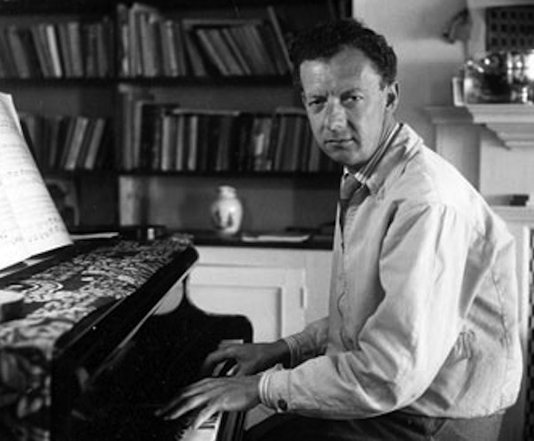 Benjamin Britten sitting at his piano, 1950. 