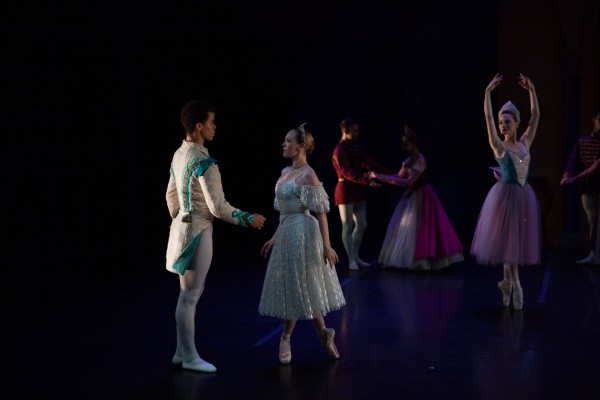 Cinderella (Elena Zahlman) meets her Prince (Steven Melendez) as the Fairy Godmother (Amanda Treiber) looks on.