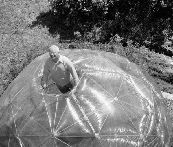 Hazel Larsen Archer, Buckminster Fuller inside His Geodesic Dome, 1949, gelatin silver print, 9 ½ x 9 ¼ inches. Estate of Hazel Larsen Archer and Black Mountain College Museum and Arts Center. 