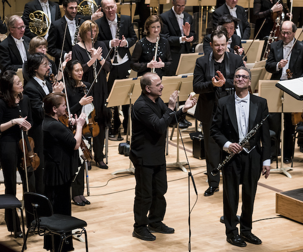Composer George Tsontakis, BSO principal English horn player Robert Sheena, Andris Nelsons, and the BSO take a bow. Photo: Lisa Voll.