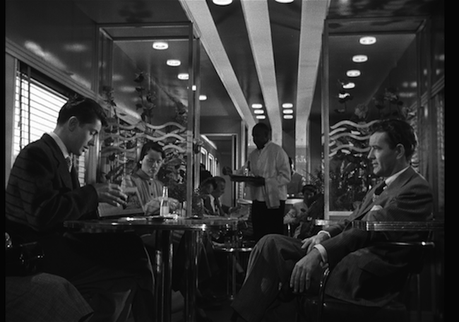 A scene featuring Farley Granger and Robert Walker in Alfred Hitchcock