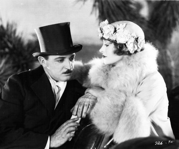 Raymond Griffith and Betty Compson in "Paradise"