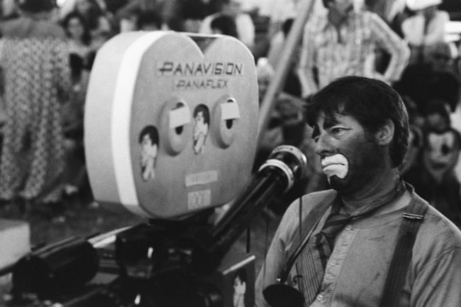 Jerry Lewis sitting next to a Panavision Camera. Photo; Owen Franken