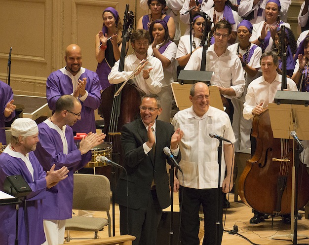 Composer Osvaldo Golijov bows with conductor Robert Spano following the performance of his "La Pasion segun San Marcos" with the BSO on Thursday night. Photo: Stu Rosner.
